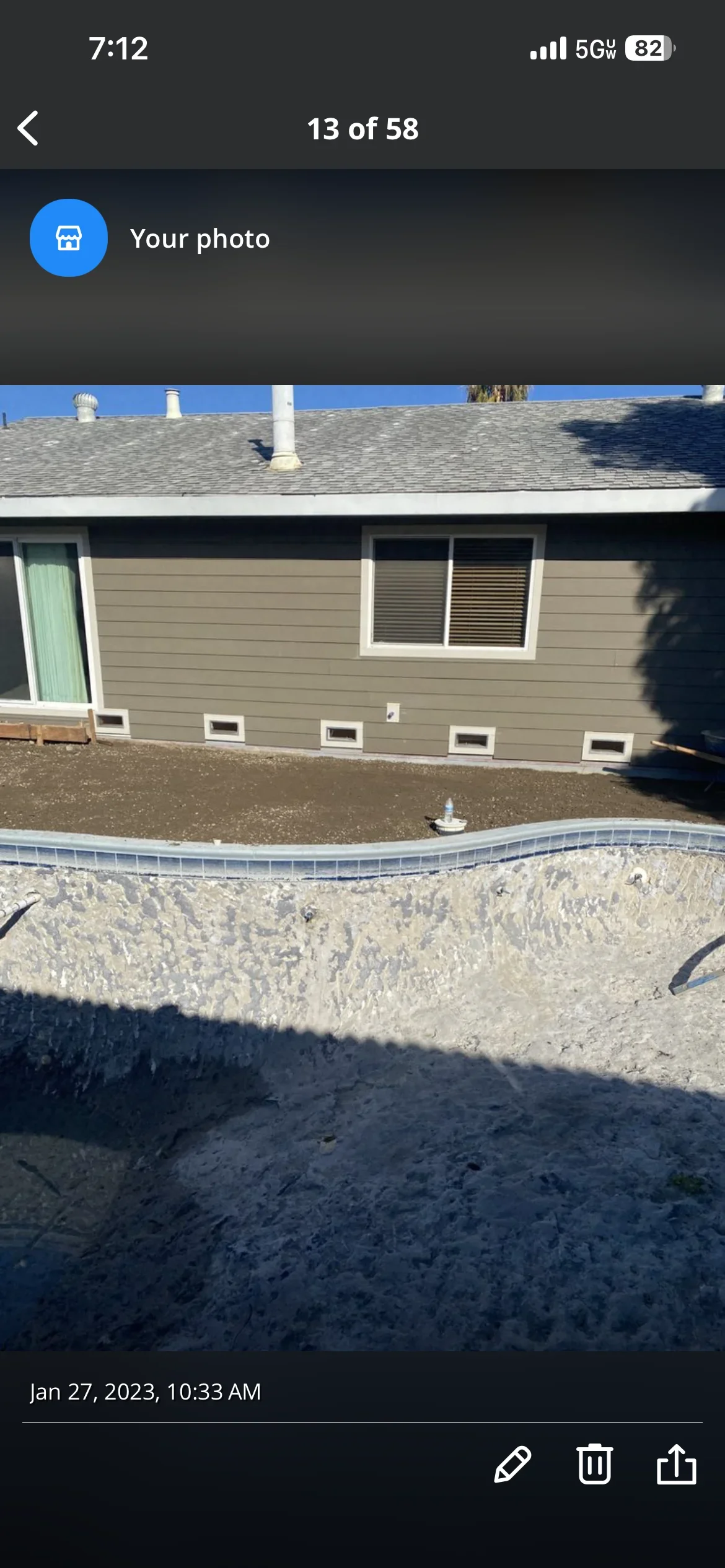 Residential foundation with grade beam, metal edging, and foundation vents installed