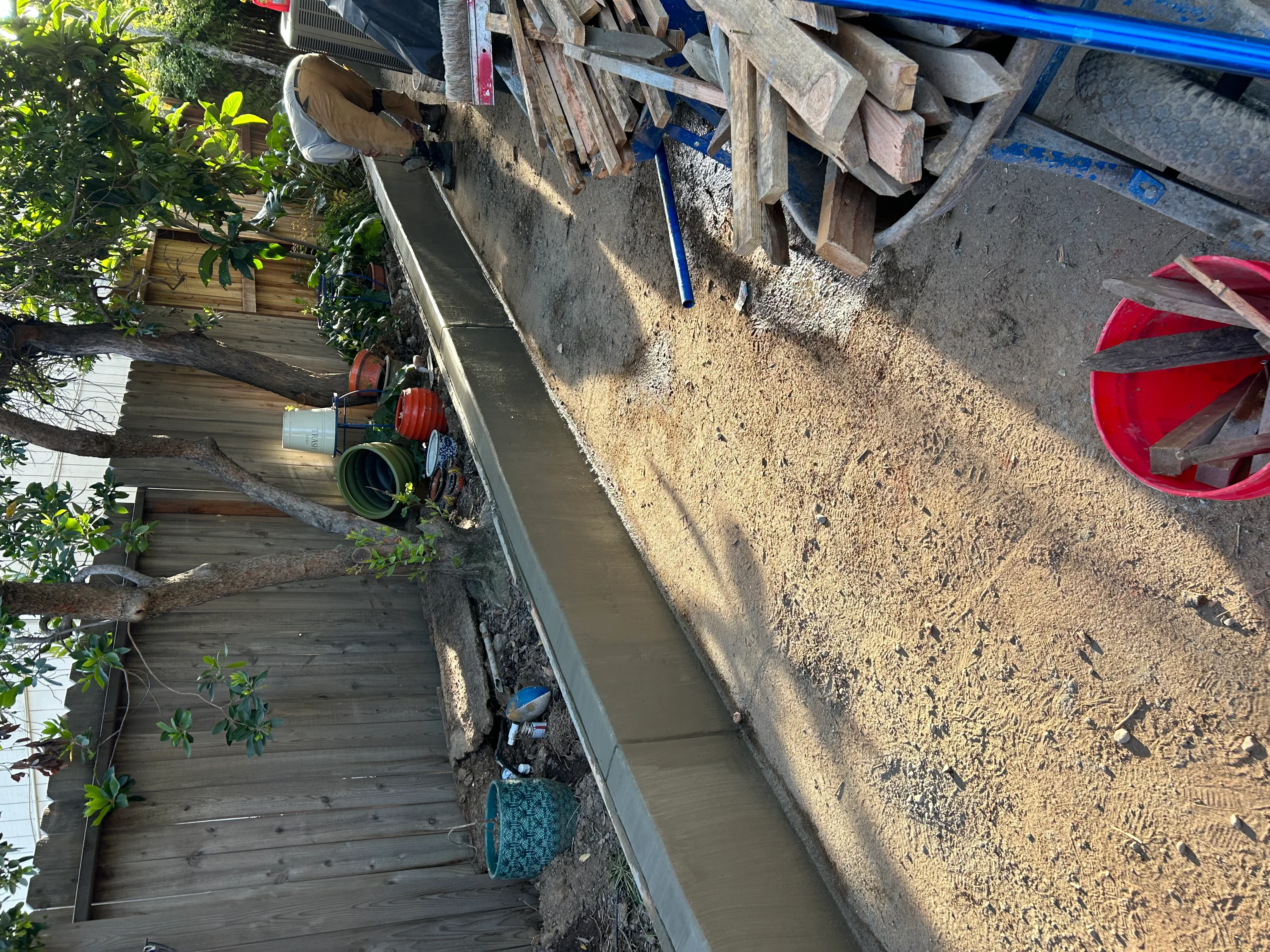 Newly installed concrete driveway with finished surface and edging, residential property