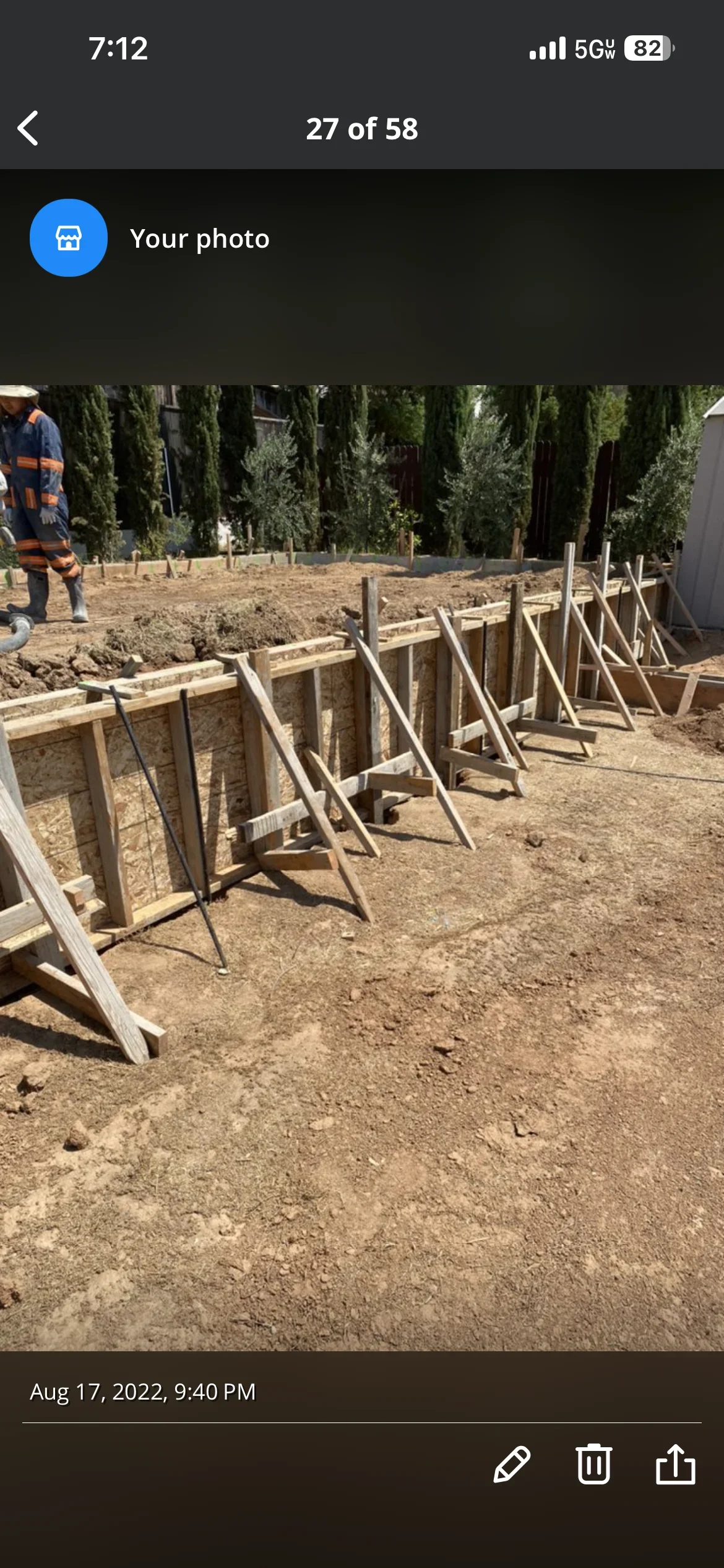Wooden concrete formwork with diagonal bracing on prepared excavation site