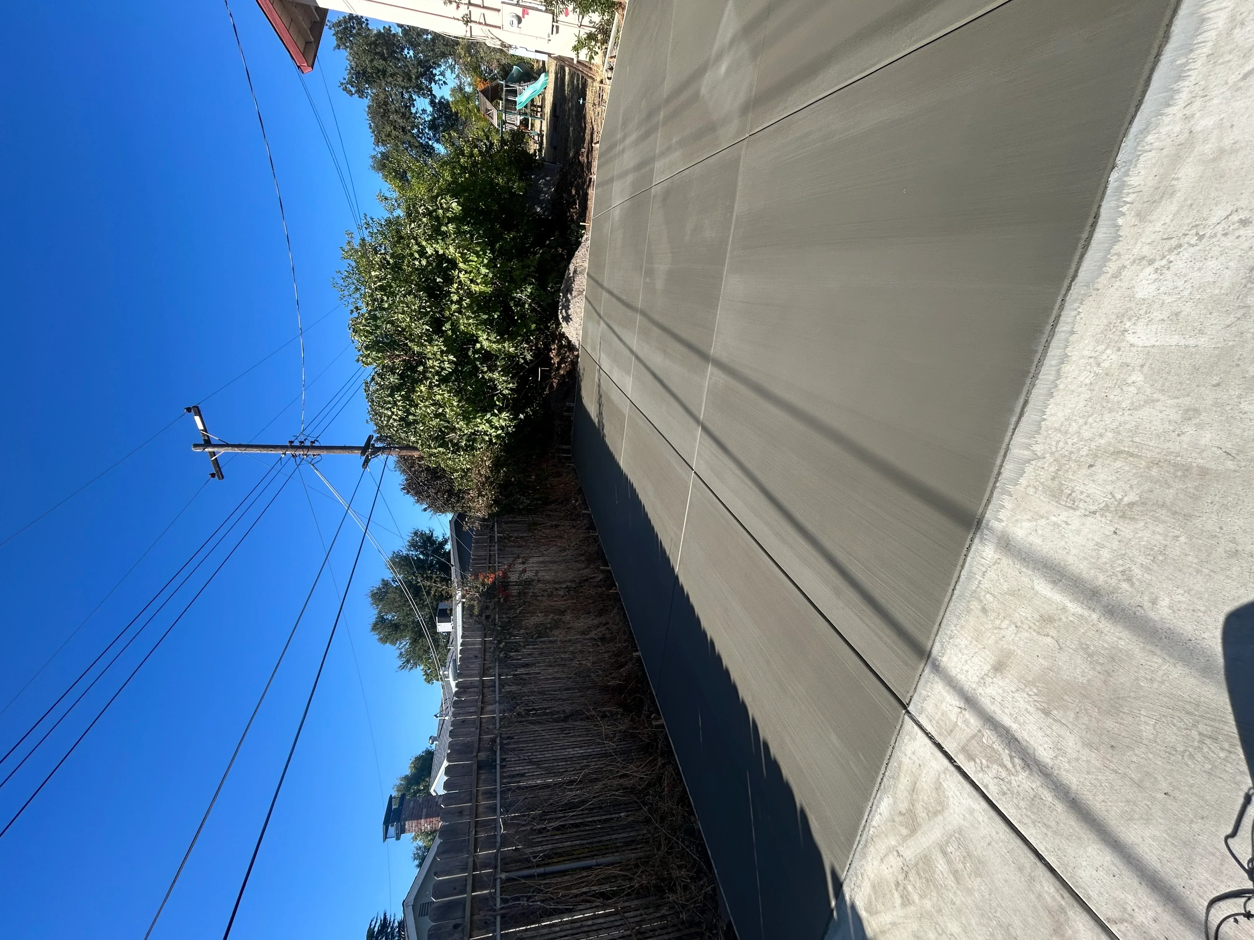 Newly poured concrete driveway with control joints and clean finish